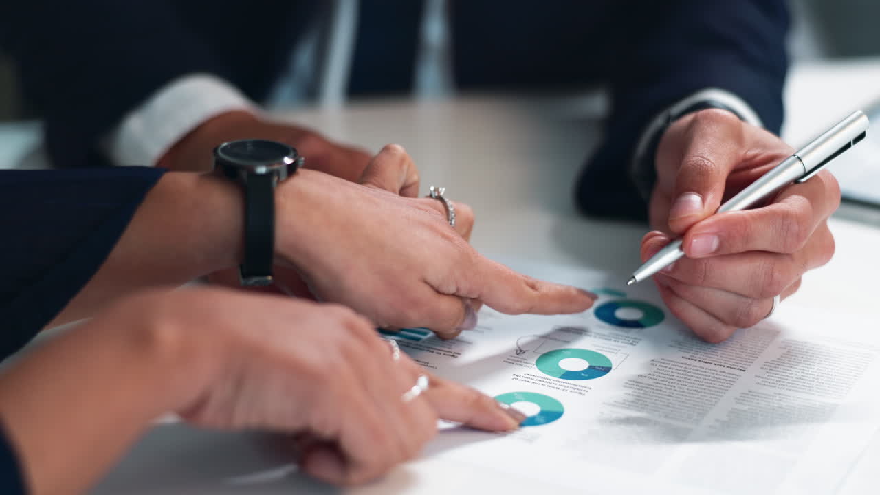 Business meeting discussing financial data