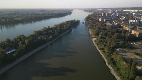 drone flies above bay next to budapest's mol campus