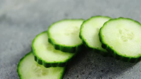 sliced cucumber on concrete