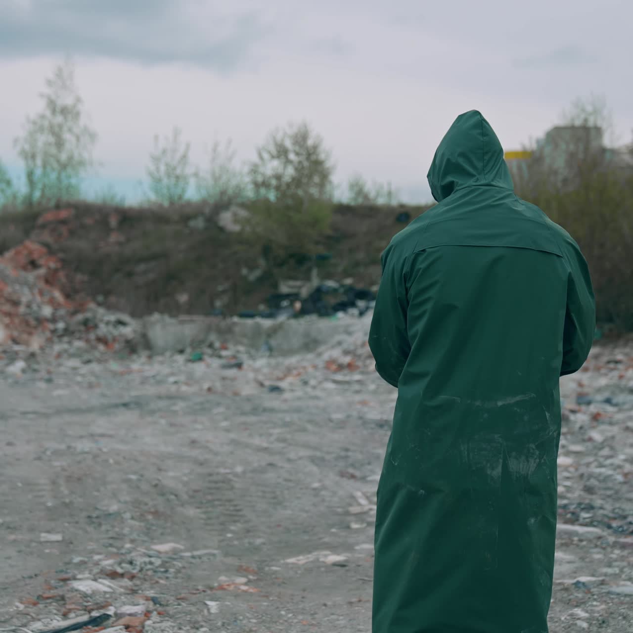 Worker in special chemical protective suite. Man in chemical protection abandoned in abandoned factory