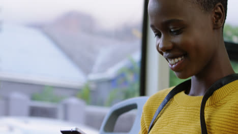 woman using mobile phone while travelling in bus 4k