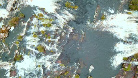 Peaceful-River-Running,-Nature-Brook-mixed-with-Mossy-Stones-and-Green-Grass