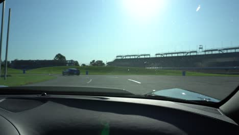driving through the interior of the indy motor speedway. summer, racing, corvettes.