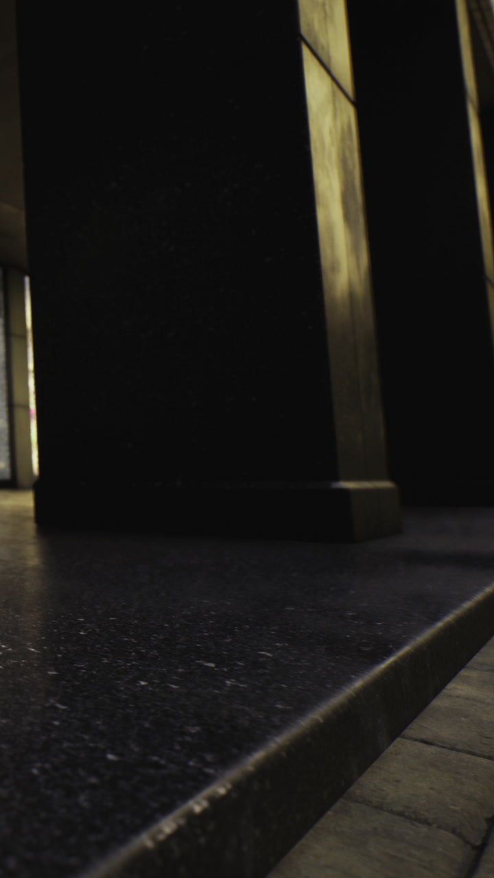 Exploring a dark corridor with sleek surfaces and shadows at sunset