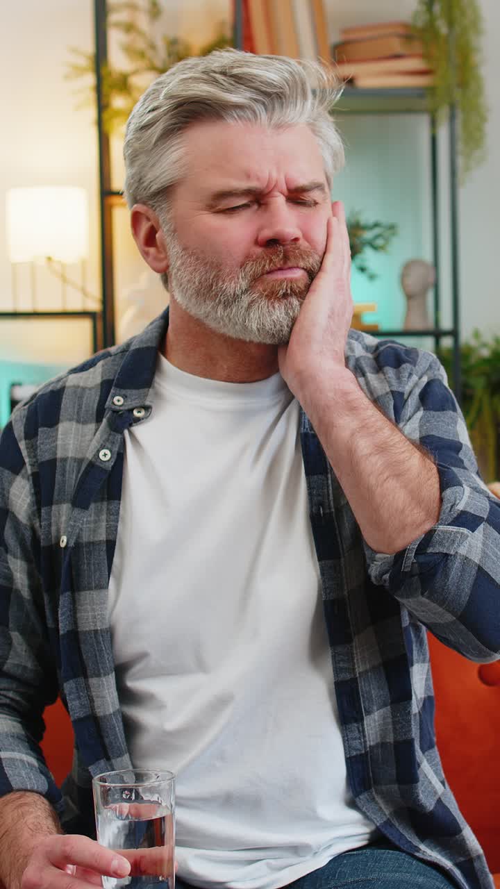 Senior middle aged man feel terrible toothache after drink cold water sensitive tooth pain cavities
