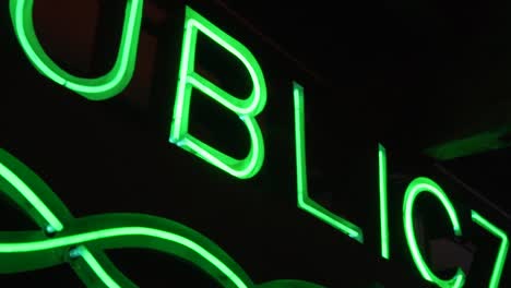 polish neon sign in a dark room in slow motion