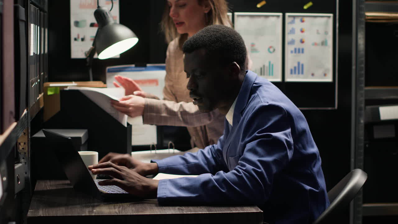 Detective working at desk with documents