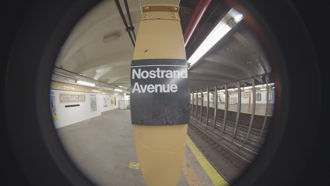 Handheld shot of the Nostrand Avenue subway station. Shot with a fish-eye lens in Brooklyn, New York City.