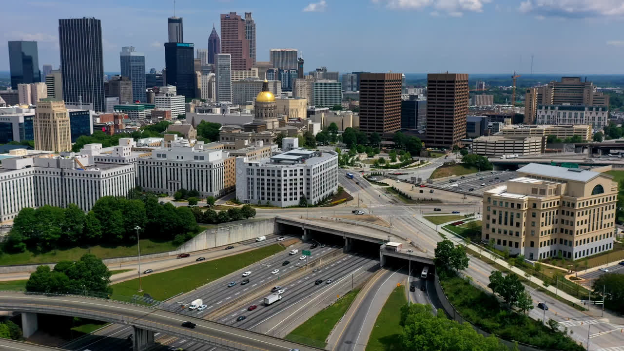 Timelapse of Atlanta Ralph David Abernathy Freeway with Georgia State Capitol government office and Downtown Atlanta skyline buildings and skyscraper in view, Georgia, USA