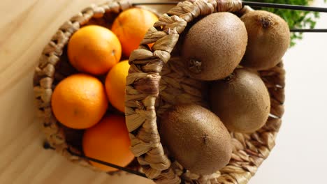 oranges and kiwis in wicker baskets