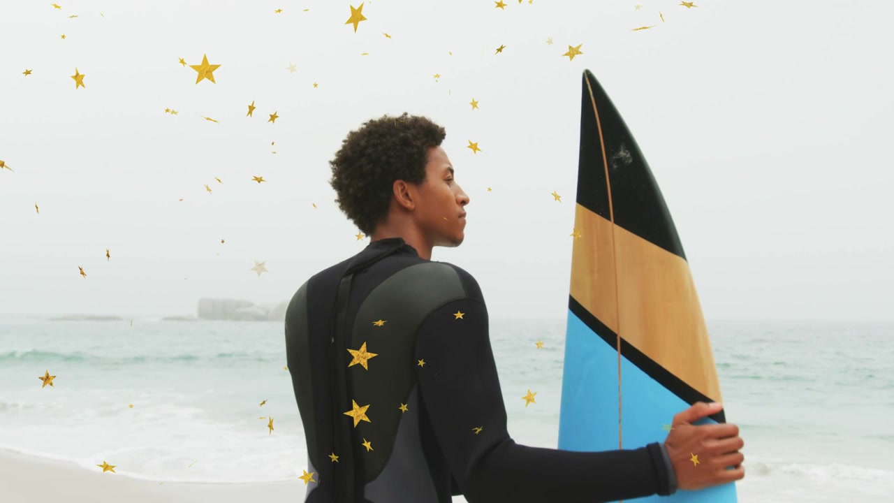 Surfer scanning sea, adjusting grip, preparing to surf with gold stars drifting around him, travel