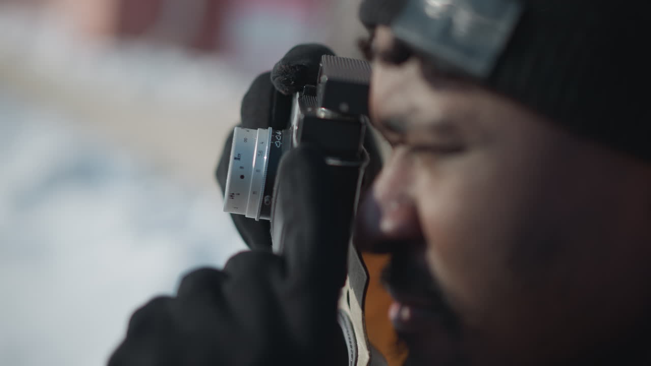 close hands photojournalist gripping digital camera, fine tuning lens settings with gloved fingers, gentle press on shutter button capturing crisp winter street moment under bright sunlight