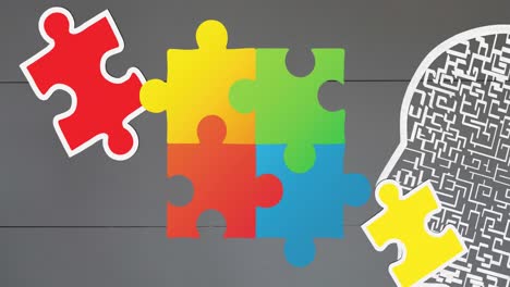 animation of colourful puzzle pieces, autism awareness month text