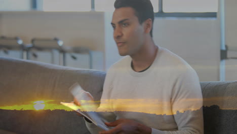 animation of biracial man reading book and sunset