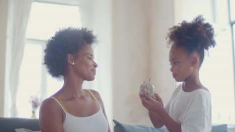 Cute-Black-girl-doing-make-up-on-her-mother