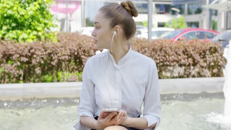 young formal girl with smartphone