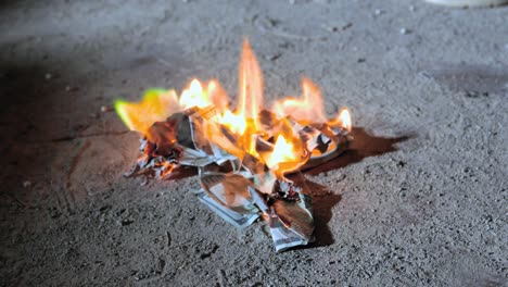 Money-burning--in-flames-on-the-ground