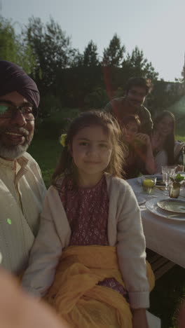 joyful family dinner gathering outdoors