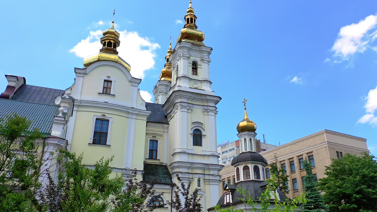 Delightful historic building of orthodox cathedral in Vinnytsia, Ukraine. Rising to the crosses on church cupolas. Blue sky at backdrop.