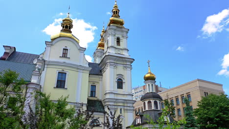 delightful historic building of orthodox cathedral in vinnytsia, ukraine. rising to the crosses on church cupolas. blue sky at backdrop.