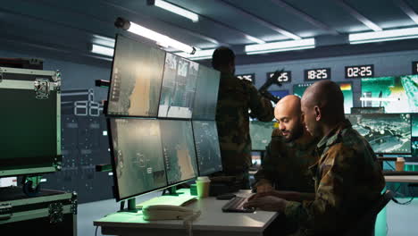 Teamworking-military-professionals-using-radar-equipment