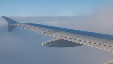 Airplane-Wing-With-Clouds-and-Turbulence