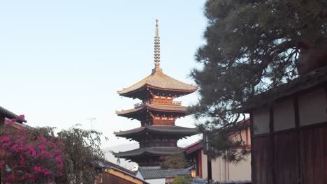 Slide-shot-of-beautiful-tall-temple-during-sunrise-in-Kyoto,-Japan-4K-slow-motion