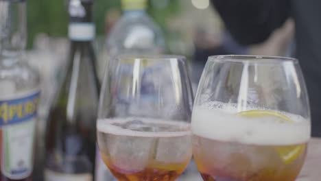 aperol spritz cocktails being prepared