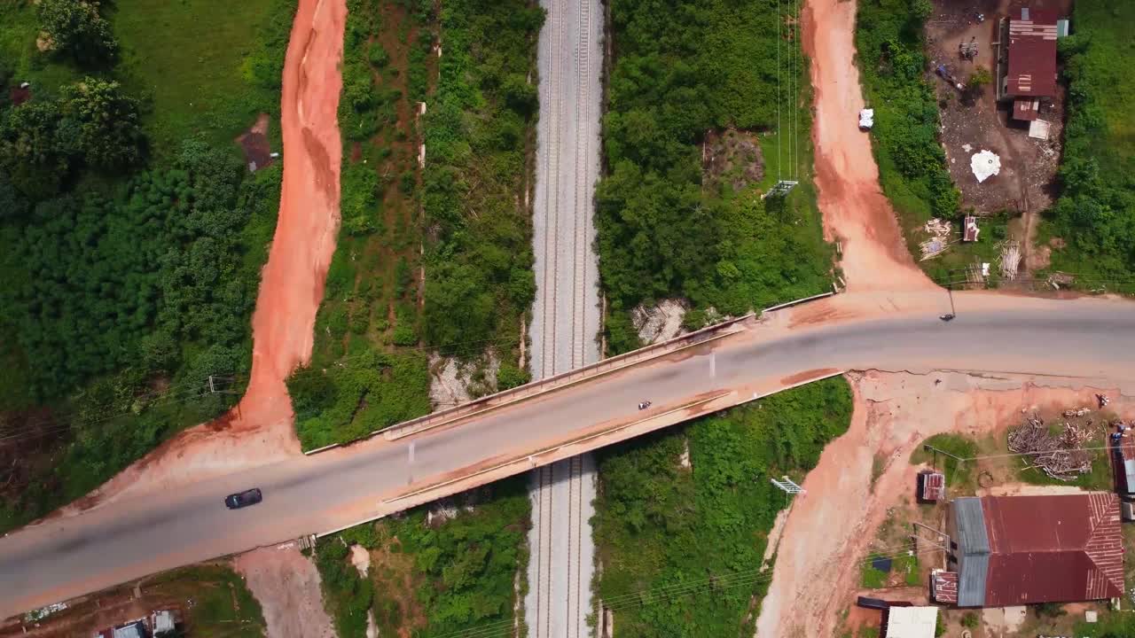 Top-down drone shot of Lagos-Ibadan railway under a bridge along Ido-Eruwa road, Ibadan.