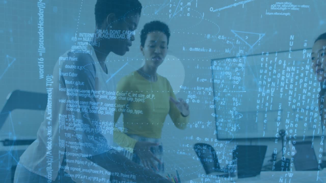 Two technology professionals leaning over laptop in modern office, with floating data graphics