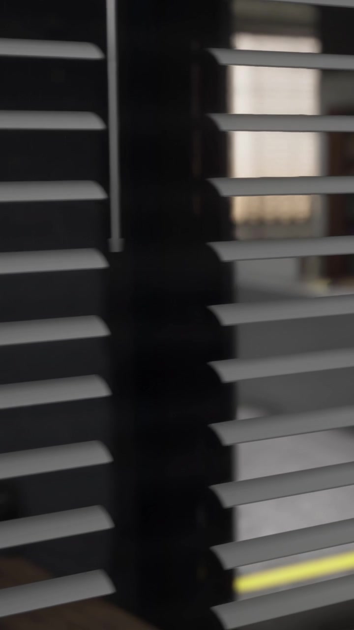 Blinds cover window in office space during working hours