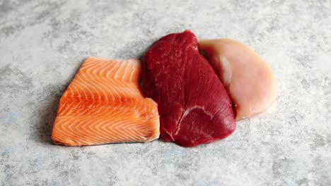 fresh raw beef steak  chicken breast  and salmon fillet