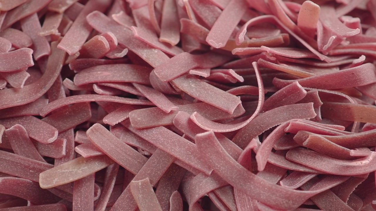Close-up of Raw Beetroot Infused Pasta Noodles