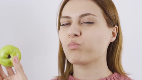 Close-up-portrait-of-woman-eating-pear.-Eat-fruit.