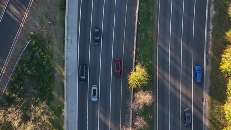 an aerial, top down shot over a highway, shot in slow-motion