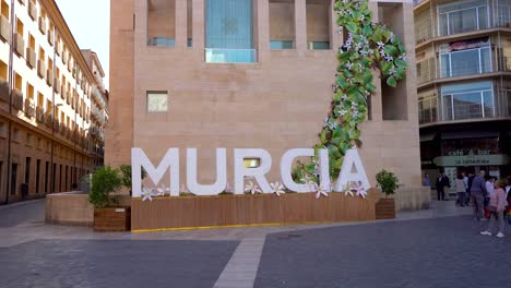 letters with the name of the city of murcia. located in the historic center of the city in cardenal belluga square. stabilized footage. people. travel destination in spain