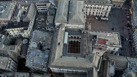 Descending-aerial-tilt-up-over-Doge's-Palace-and-Grimaldina-tower-in-Genoa-Italy