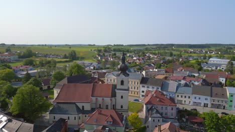 Dramatic-aerial-top-view-flight-Church-in-village-Heidenreichstein,-city-in-Austria-Europe,-summer-day-of-2023