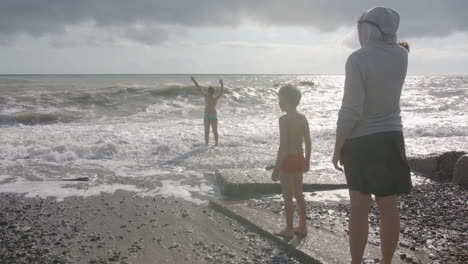 family enjoying a stormy beach day