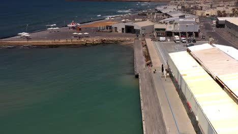 tel aviv waterfront with pier and shops