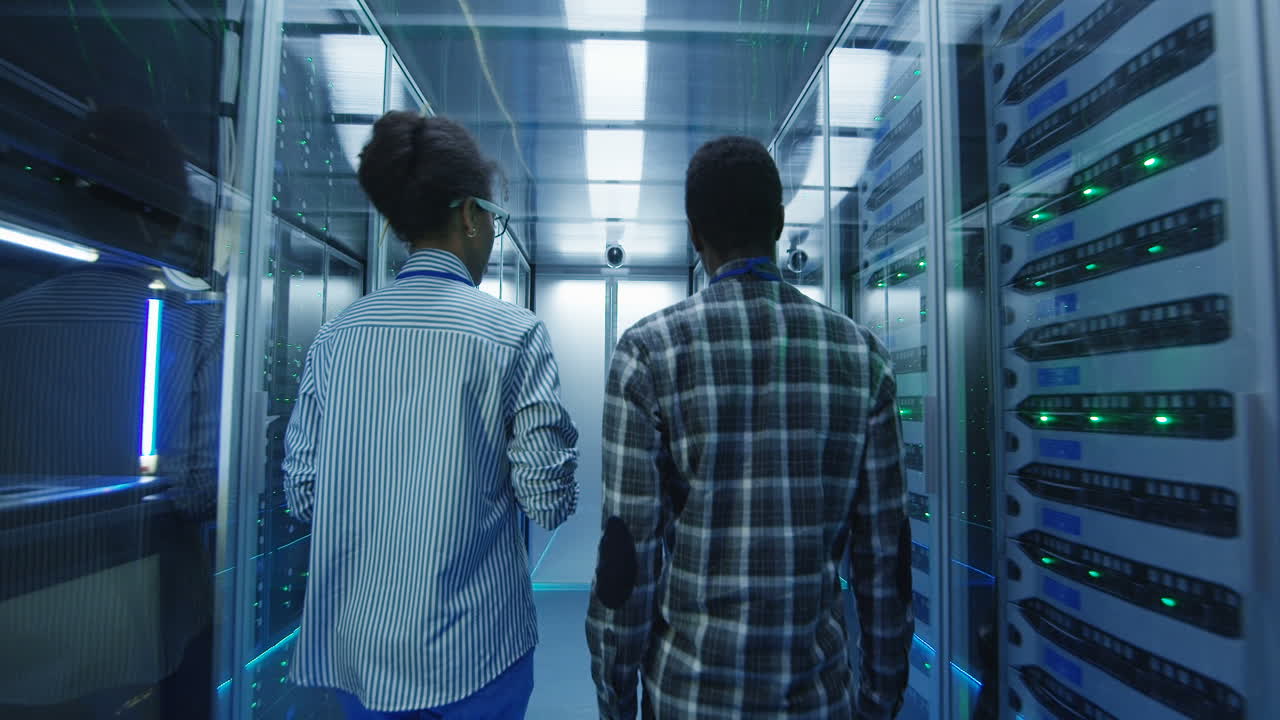 IT Professionals Walking Through a Data Center