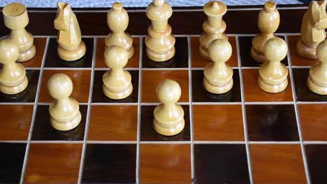 wood chessboard and wooden chess pieces