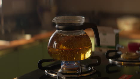 tea boiling inside a glass vessel