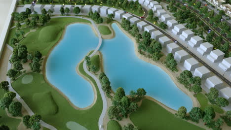 scale model of residential development with golf course and lake