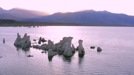 4K-Aerial-of-Tufa-Rocks-in-Mono-Lake,-at-sunset