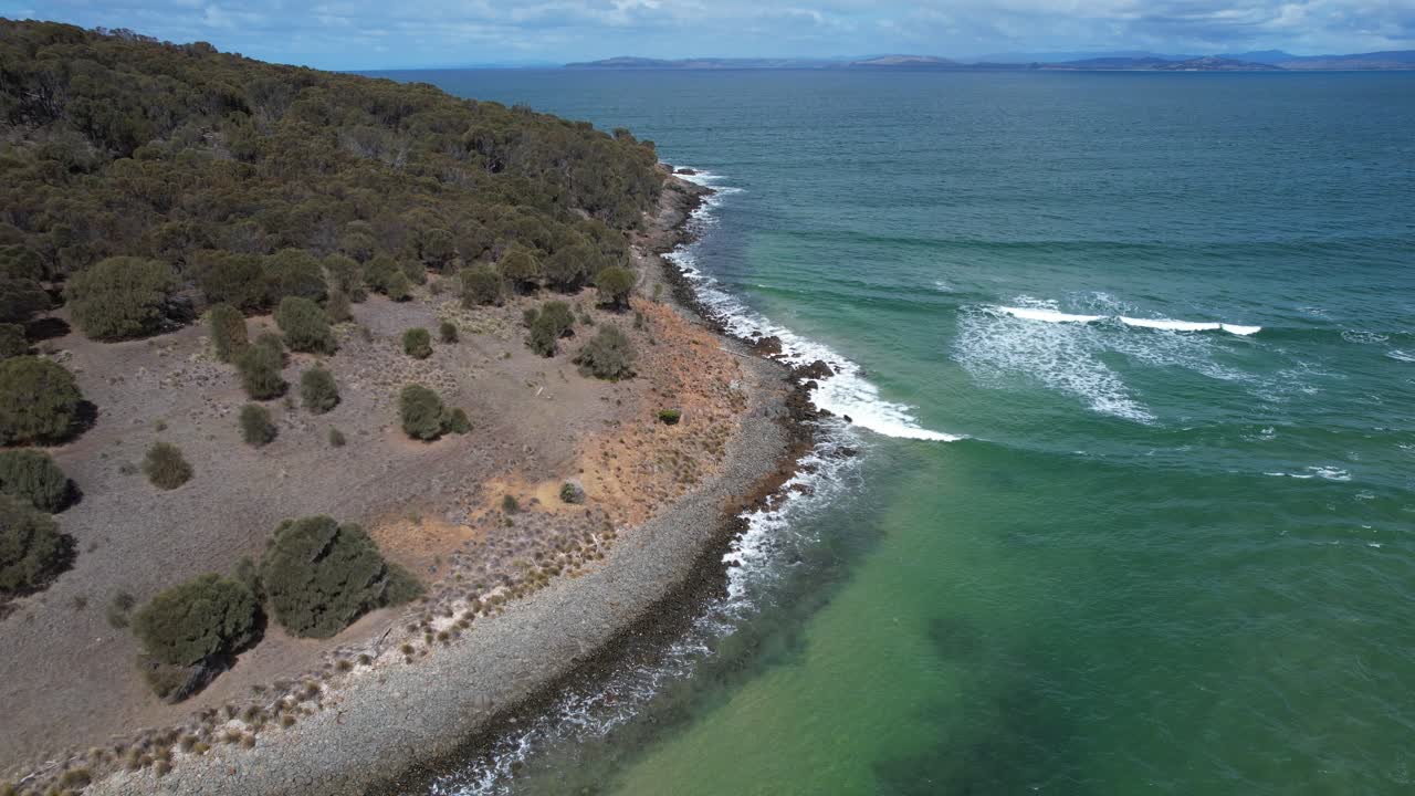 Waves Splashing On Rugged Coast Of Carlton Beach In Tasmania, Australia - Aerial Pullback