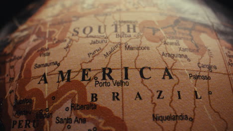 close-up of a vintage world globe focusing on south america and brazil