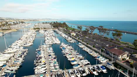 aerial flyover view above the scenic marina and harbour of dana point, california