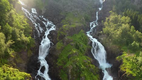 Latefossen-is-one-of-the-most-visited-waterfalls-in-Norway-and-is-located-near-Skare-and-Odda-in-the-region-Hordaland,-Norway.-Consists-of-two-separate-streams-flowing-down-from-the-lake-Lotevatnet.