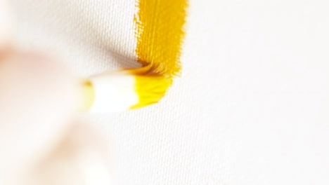 painting with a yellow brush